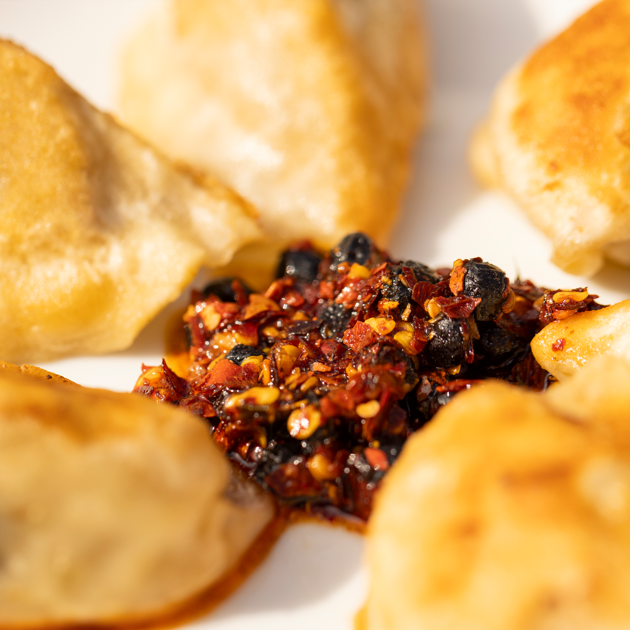 Ni-Howdy seed oil free Sichuan chili crunch served on rice, eggs, or noodles with bold Asian flavor